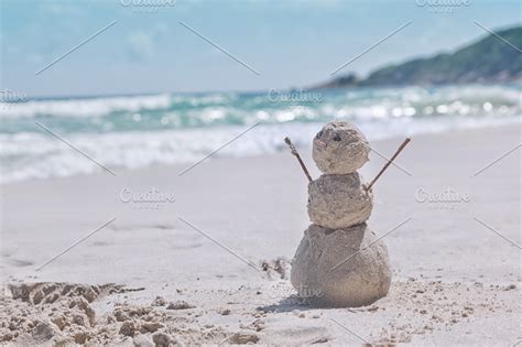 Snowman on the tropical beach | High-Quality Holiday Stock Photos ~ Creative Market