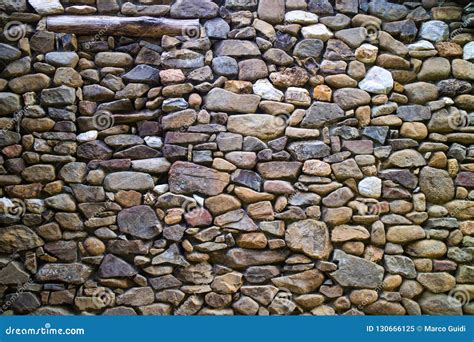 River stone wall stock image. Image of shape, background - 130666125