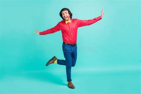 Photo of Excited Funky Man Wear Jeans Shirt Holding Credit Card Empty Space Isolated Yellow ...