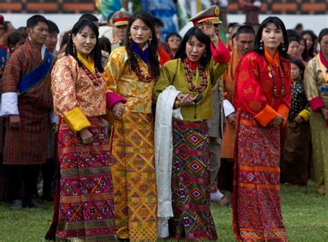 King of Bhutan kissing his bride 21-year-old student Jetsun Pema during their marriage ...