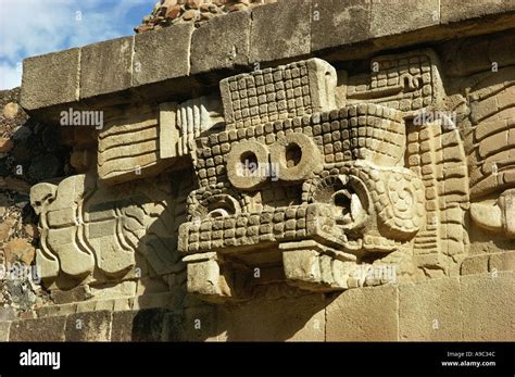 Head of rain god Tlaloc at ruins of Quetzalcoatl temple or pyramid ...