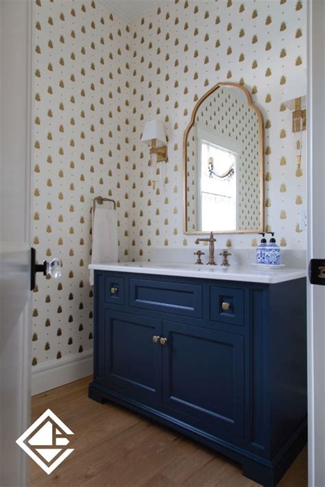 This navy blue custom vanity provides the perfect contrast to the statement wallpaper behi… in ...