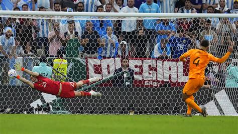 WATCH: Emiliano Martinez's stunning saves in penalty shootout keep Lionel Messi's World Cup ...