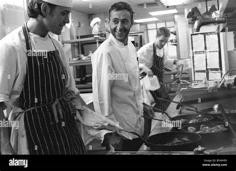 Chef Michel Roux at Le Gavroche chatting with one of his sous chefs Stock Photo - Alamy