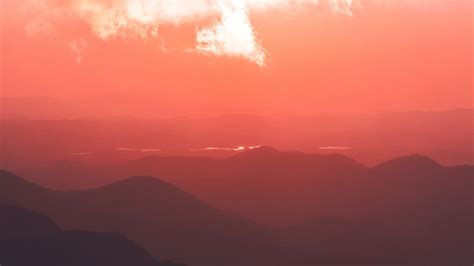 Download wallpaper 2560x1440 sunset, mountains, fog, clouds, dusk widescreen 16:9 hd background