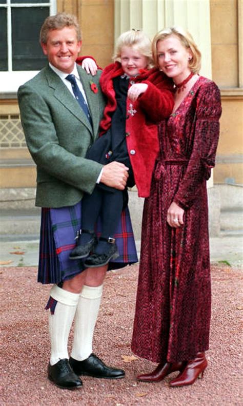 Colin Montgomerie of Great Britain with his wife Eimear and daughter Olivia after receiving an ...