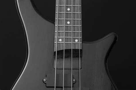 Close Up Photo of Gray Electric Bass Guitar · Free Stock Photo