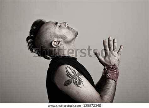 Tattooed Young Man Praying His Hands Stock Photo 125572340 | Shutterstock