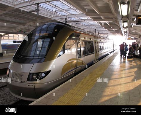 passengers boarding the Gautrain at Oliver Tambo International Airport ...