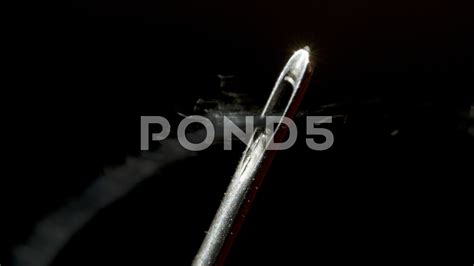 Threading through the eye of a needle in macro Stock Footage #AD ,# ...