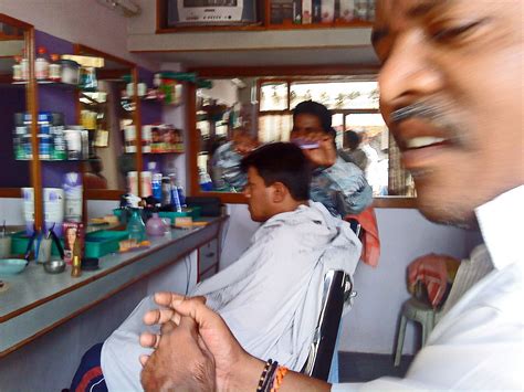 Stock Pictures: Indian Hair stylists at work in small salons