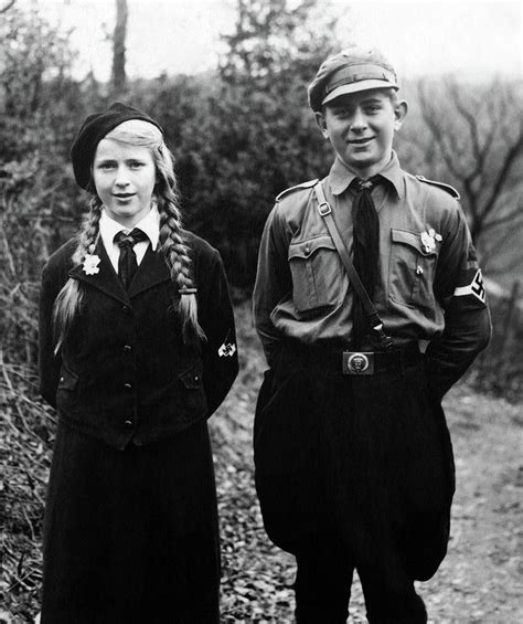 Brother and sister wearing their Hitler Youth and BDM uniforms in National Socialist Germany ...