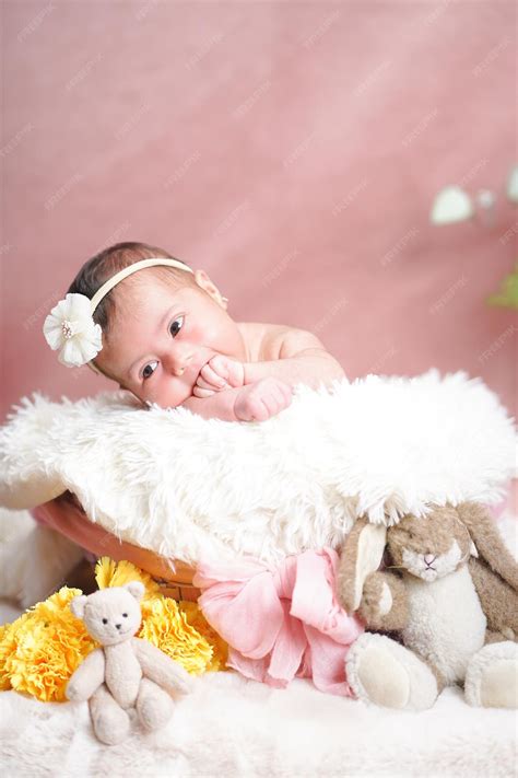 Premium Photo | Newborn baby in studio photo on pink background