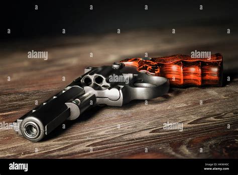 The gun on the table Stock Photo - Alamy