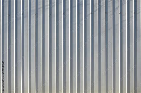 Siding, metal panels texture closeup in the daytime outdoors. Metal ...