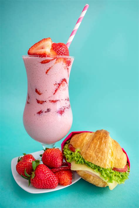 Strawberry Smoothie Near Strawberries · Free Stock Photo