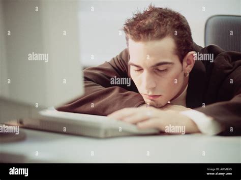 Man sleeping in office Stock Photo - Alamy