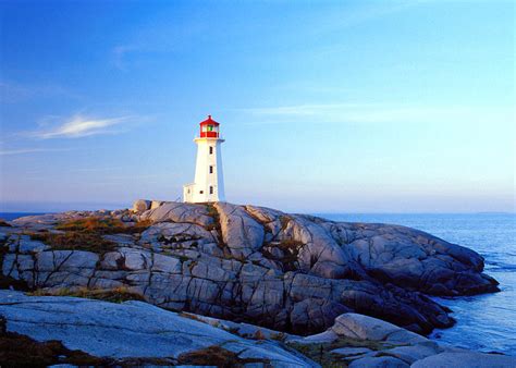 Peggys Cove Lighthouse At Sunrise by Photorx