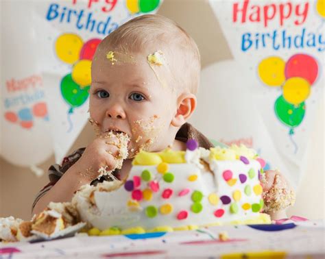 Baby eating birthday cake – License image – 11162001 Image Professionals