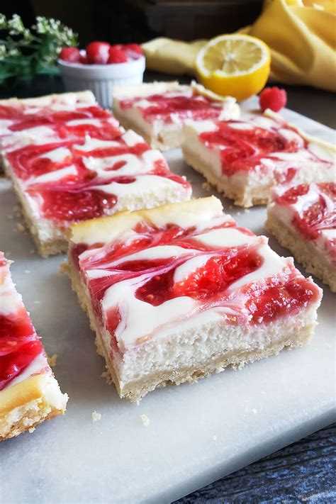 Raspberry Swirl Cheesecake Bars | Sincerely Asma