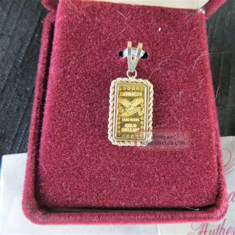 American. 999 Fine Gold 1 Gram Bar Pendant 14k Mount