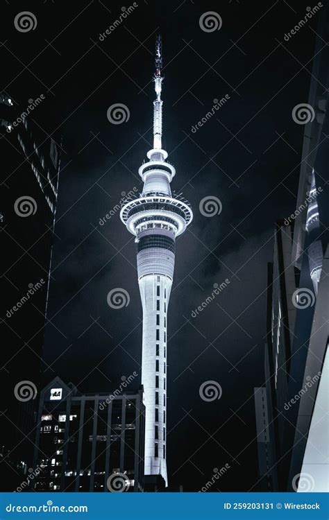 Vertical Shot of the Sky Tower Illuminated by Lights at Night in ...