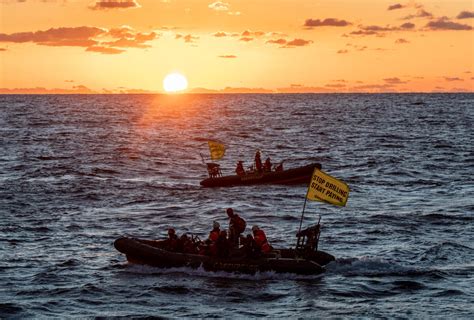 Greenpeace climate justice activists board and occupy Shell platform en route to major oilfield ...