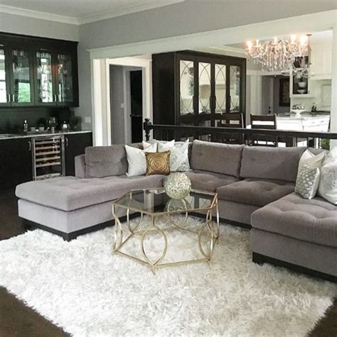 Gray sectional, black built ins and white shag rug | Rugs in living room, Shag rug living room ...