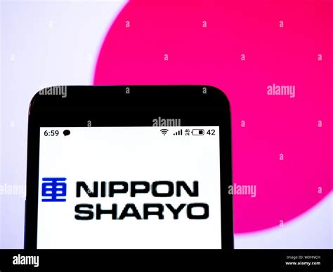 In this photo illustration the Nippon Sharyo, Ltd. logo is seen ...