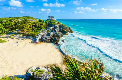 Mayan ruins of Tulum at tropical coast. God of Winds Temple at paradise beach. Mayan ruins of ...