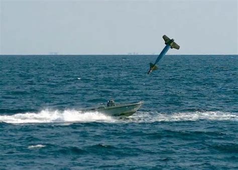 Stunning image captures a split second before a GBU-10 bomb dropped by a B-1 hits a small boat ...