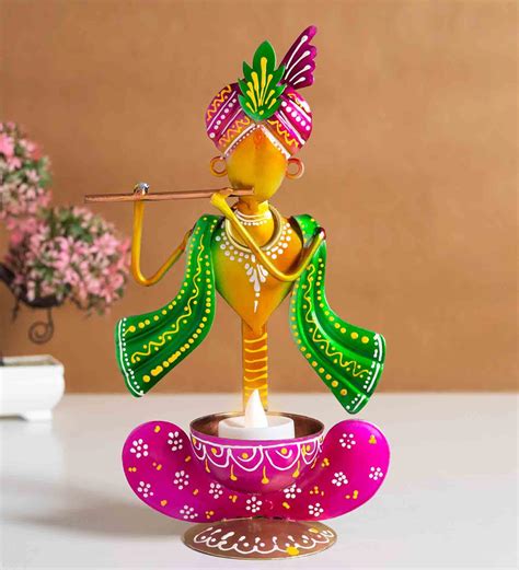 Buy Ganesha Magenta Metal Table Tealight Candle Holders at 72% OFF by Golden Peacock | Pepperfry