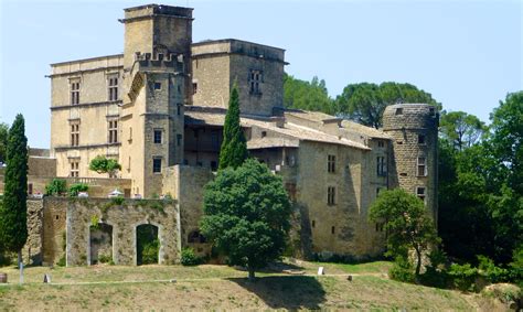 Visit the Lourmarin Château, on the edge of the fairy tale village of Lourmarin, Provence’s ...