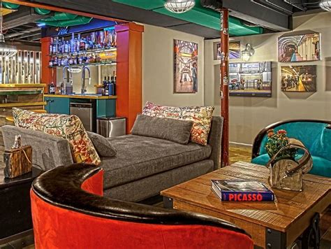 Colorful basement man cave with art on the wall, colorful bar fully ...