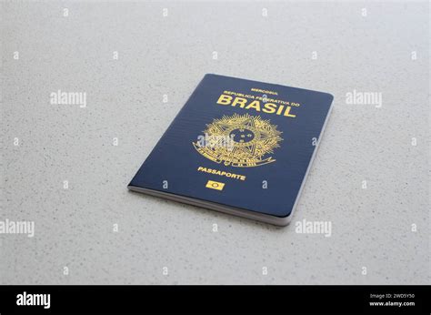 Detailed view of the blue and golden cover of the Brazilian passport, symbolizing identity and ...