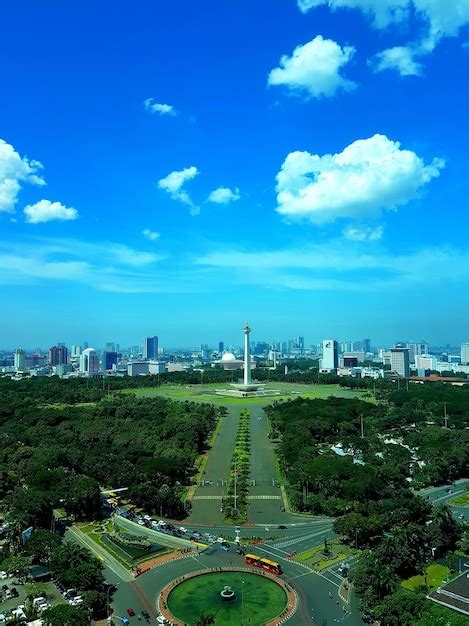 Premium Photo | Aerial view of buildings in city against blue sky