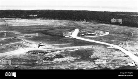 Aerial view of Henderson Field on Guadalcanal, possibly taken from above the runway looking ...