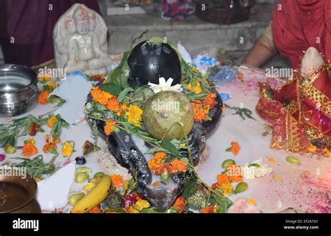 Maha Shivratri puja - Shivlinga with Bel (a fruit) during Maha ...