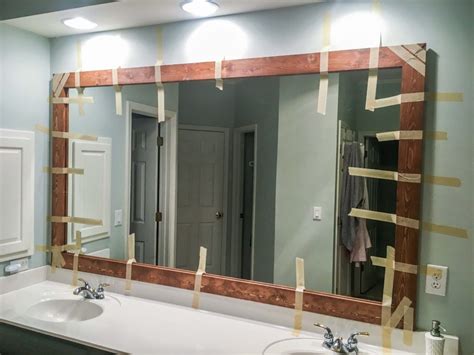 How to DIY Upgrade Your Bathroom Mirror With a Stained Wood Frame ...