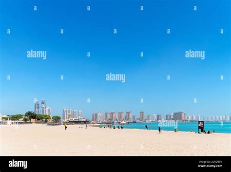 Katara Beach looking towards the skyline of The Pearl Qatar development, Doha, Qatar, Middle ...