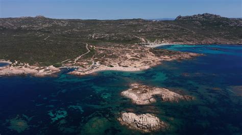 Aerial view of a beach and sea coast with small rocky island 20751212 ...