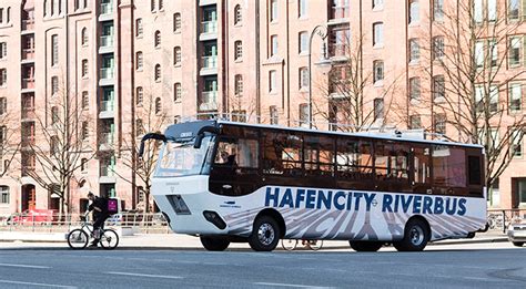 In Hamburg you can cruise on the river on a bus. It's MAN Hafencity ...