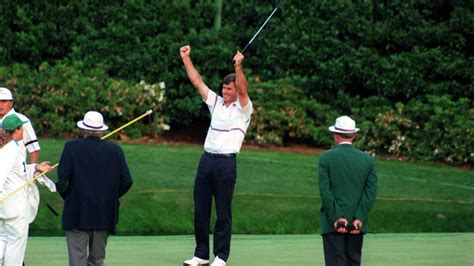 Nick Faldo throws his arms up in victory after winning the 1990 Masters over Raymond Floyd.