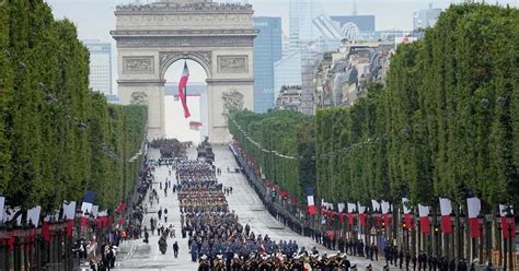 France celebrates national day with traditional military parade