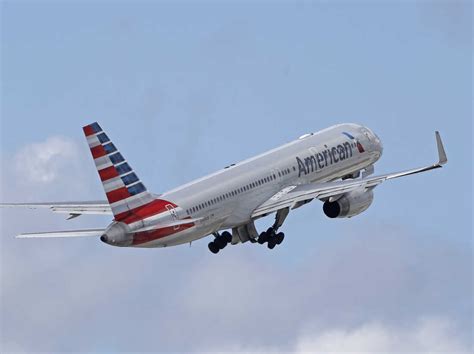 American Airlines flight diverted after passenger tries to open plane ...