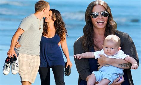 A beaming Alanis Morissette takes baby son on his first Ever family ...