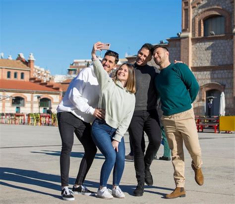 Premium Photo | Group of cheerful young friends taking selfie portrait ...