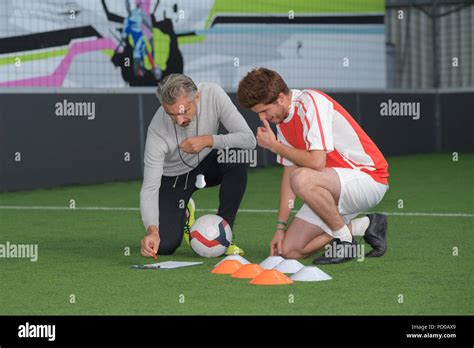 soccer player and trainer Stock Photo - Alamy