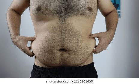 73 Man Showing Belly Button Images, Stock Photos, and Vectors | Shutterstock