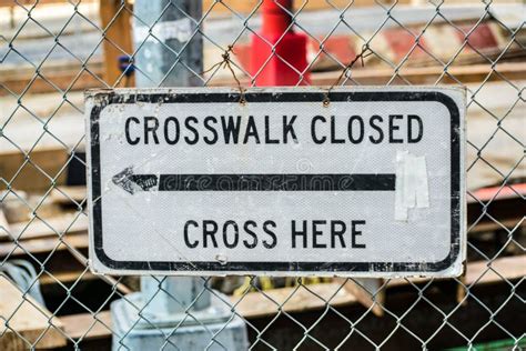 A Crosswalk Closed, Cross Here Sign In Front Of Intersection Stock ...